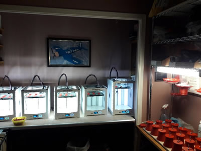 Five 3-D printers making nectar heaters.